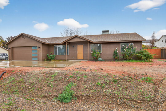 Professional Inspects Open Soil Area Showing Potential For Future Suburban Building Projects