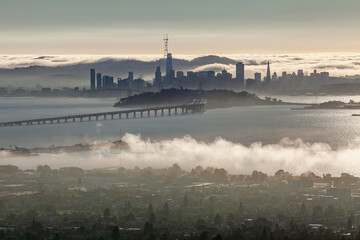 San Francisco skyline and Bay Bridge with fog over Treasure Island