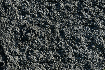 Texture concrete wall of light grey color cement texture background. Grey pastel rough crack cement texture stone concrete, rock plastered stucco wall; painted flat fade background. Side view.