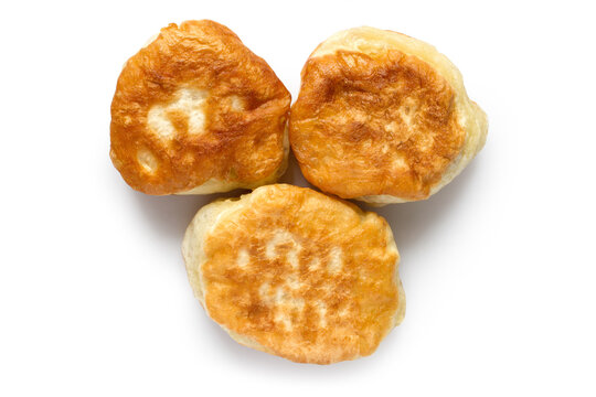 Three thick homemade pancakes on a white background. Close-up of homemade pastries