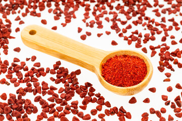 Bixa Orellana - Crushed annatto seeds in the spoon