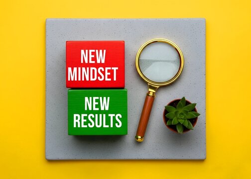 A top view of new mindset new results. Concept, personal and business development. Written on wooden blocks.