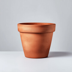 Classic empty terracotta flower pot isolated on white background