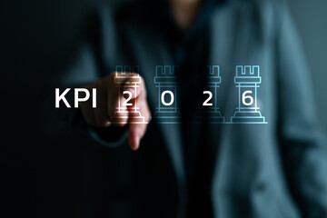 Businessman pointing at KPI 2026 with chess rook icons, symbolizing strategic goal setting, performance measurement, planning and business success through key performance indicators. © bixpicture