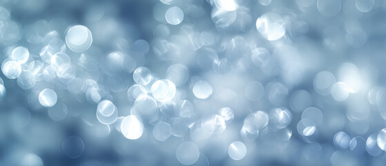 Soft Light Blue Bokeh Lights Background with Glowing Blurred Orbs of Light