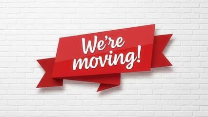 We're Moving Ribbon on White Brick Wall relocation