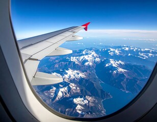 Obraz premium Aerial view from an airplane window, showing a mountainous landscape