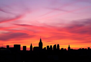Fototapeta premium Iconic London skyline silhouette at twilight, dark against a vibrant sky, contrast, westminster