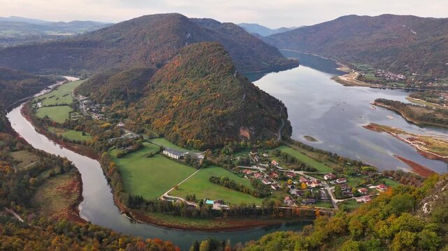 High wide drone establishing shot of Lac de Coiselet and the confluence plain of the Ain and Bienne rivers, seen from the belv&eacute;d&egrave;re above Chancia - Condes on the Jura&ndash;Ain border, France