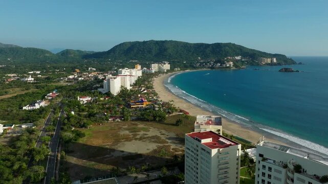 DRONE: CRANE SHOT OF THE HOTELS AND BEACH AT IXTAPA, ZIHUATANEJO