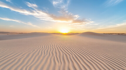 Desert sand dune sunrise ripple pattern sky clouds warm light tranquil vista