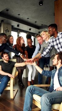 Team celebrates success, Workplace camaraderie with enthusiastic celebration and laughter, Diverse team members share moment of victory through lively cheers and camaraderie