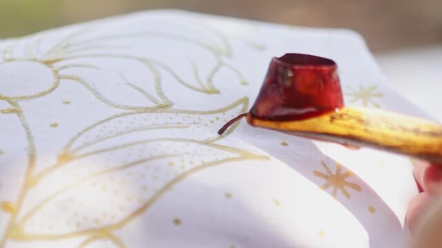 Traditional Indonesian batik making with hot wax