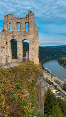 Obraz premium Ancient ruins on a hill opposite the Moselle wine town of Traben-Trarbach, Germany, July 23, 2024.