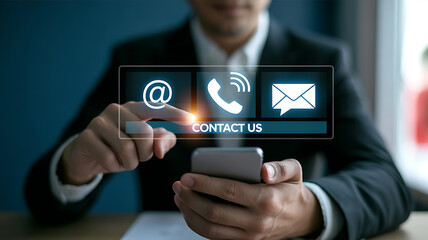 Contact us button press with phone email icons on touchscreen interface a modern communication, business assistance and connectivity concept