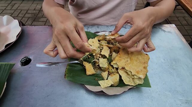 Savor the authentic taste of Pecel and Tempe, a true Indonesian delight. Delicious Pecel served with crispy tempe for a perfect meal experience. Indulge in the flavor of Pecel