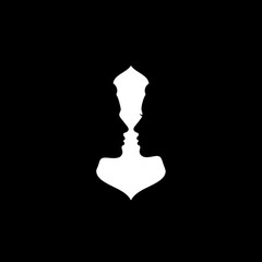 Optical illusion silhouette of two faces forming a vase shape.