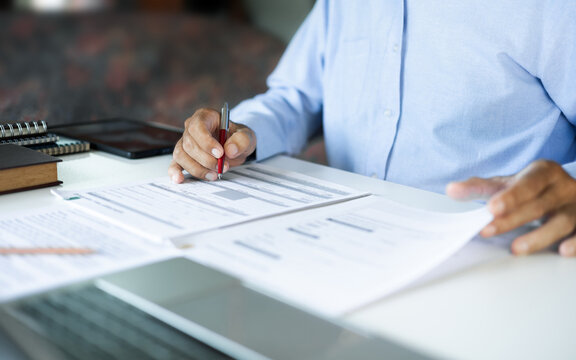asian businessman, legal expert, professional lawyer working on desk reviewing document and business contract before provide legal advice to clients