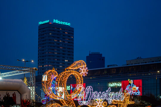 Festive market lights with the Hisense tower and Wars Sawa Junior mall in the background create an urban panorama