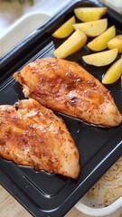 Grilled Chicken Breast with Roasted Potato Wedges