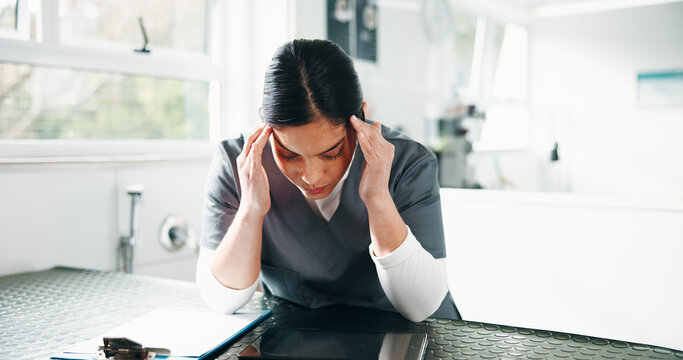 Veterinarian, headache and woman with pain, burnout and overworked with pressure. Person, professional and doctor in clinic, migraine and tension with stress, overwhelmed and anxiety with bad news