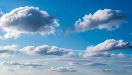 Fototapeta premium Vivid Blue Sky with Scattered White Cumulus Clouds on a Bright Sunny Day, Atmospheric Landscape Background Showing Clear Weather and Soft Cloud Formations