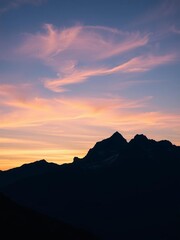Fototapeta premium Mountain peaks silhouetted against a breathtaking sunset sky, beauty, nature