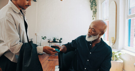 Man, barber or customer paying with phone for payment, banking or pos machine in salon. Male people, hairdresser or client with mobile smartphone app for NFC tap or wireless transaction in parlor