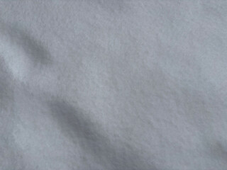 Obraz premium Soft light grey textured surface with subtle shadows and gentle folds