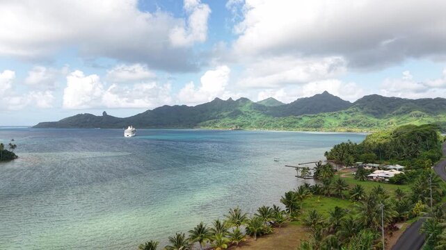 French Polynesia, Drone Shot of Cruise Ship in Bay of Island, Coastal Landscape and Lagoon