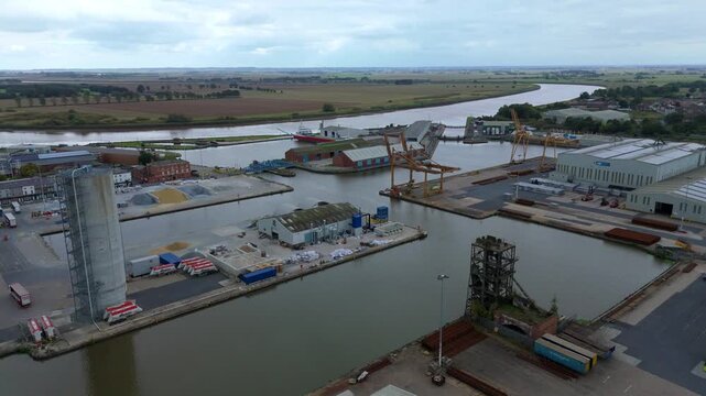 Cinematic aerial survey of Goole&rsquo;s industrial waterfront featuring dockside machinery, moored freight ships, transport yards, and major Yorkshire logistics infrastructure.