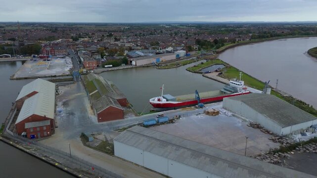 drone footage capturing Goole&rsquo;s industrial port layout with cranes, river vessels, dock platforms, and warehouse districts central to UK freight routes.