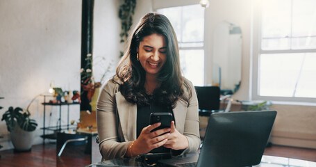 Woman, laptop or phone in hair salon with smile for text message, customer feedback and notification. Happy, person or computer with tech in hairdresser for good review, client email or satisfaction.