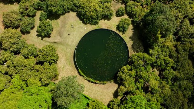 DRONE: TOP DOWN SHOT OF A BIG WATER STACK AT AN AVOCADO FARM IN MICHOAC&Aacute;N