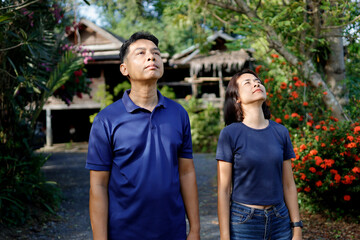 Fototapeta premium Woman and man stretches before exercising in the morning.