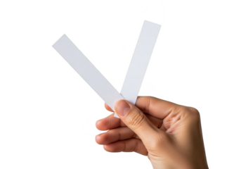 Hand holding two white strips isolated on transparent background
