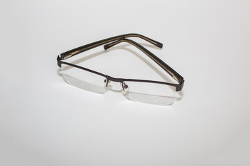 Men's Eye Glasses on white surface. Reading or prescription glasses.