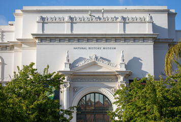 View of the sign on top of the entrance to the Natural History Museum in Balboa Park in San Diego, California.