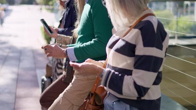 Seniors using their mobile phones outdoors