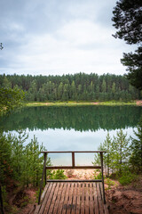 Tranquil Forest Reflected in Calm Lake