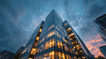 Modern office building with digital network connections over a twilight sky representing smart technology