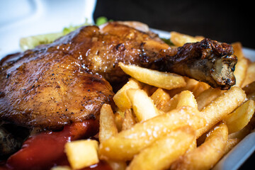 Delicious BBQ chicken served with crispy French fries and fresh salad. Tasty grilled meal with smoky flavor, perfect for food photography, restaurant menus, ads, and culinary promotions.