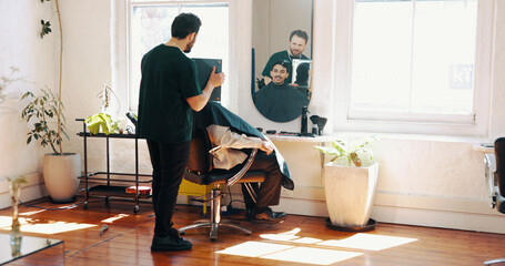 Consultation, mirror and barber with client in salon for haircut, maintenance or discussion....
