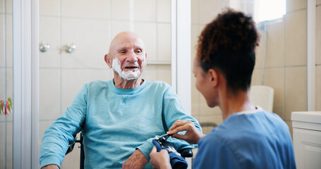Senior man, nurse and shaving cream in bathroom with wheelchair, happy and talk with grooming in home. People, caregiver and elderly person with disability, foam or facial hair removal in retirement
