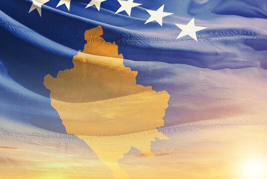 Kosovo national flag waving in the sky. - Powered by Adobe