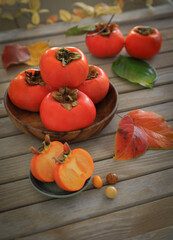 fresh Persimmons on wooden table