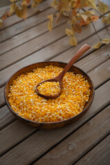 corn flakes in a wooden bowl