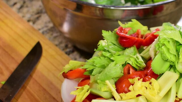 Close-up, high-quality slow-motion clip of fresh, healthy vegetables spinning, ideal for clean eating videos or recipe advertising.