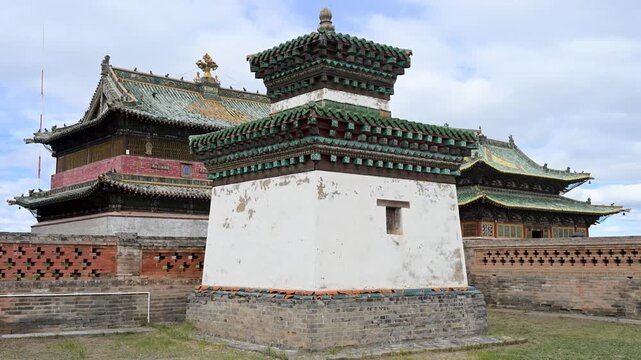 A historic shrine stands at Erdene Zuu, Mongolia's oldest monastery. The 16th-century pavilion displays ornate green tiles and traditional design, preserving ancient religious artistry.