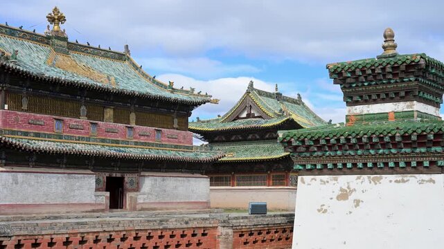 A historic shrine stands at Erdene Zuu, Mongolia's oldest monastery. The 16th-century pavilion displays ornate green tiles and traditional design, preserving ancient religious artistry.